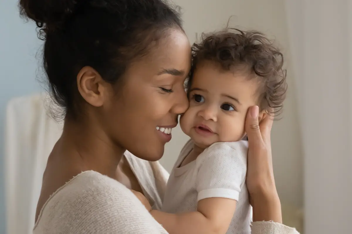 image of a mother holding her young child