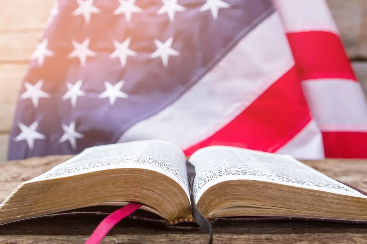 religious-freedom image of american flag and religious book illustrating subjects civil rights attorneys can help protect