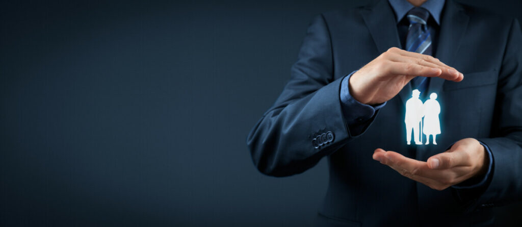 person's hands hold images of figures