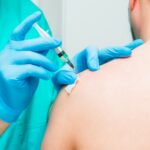person receiving a vaccine injection