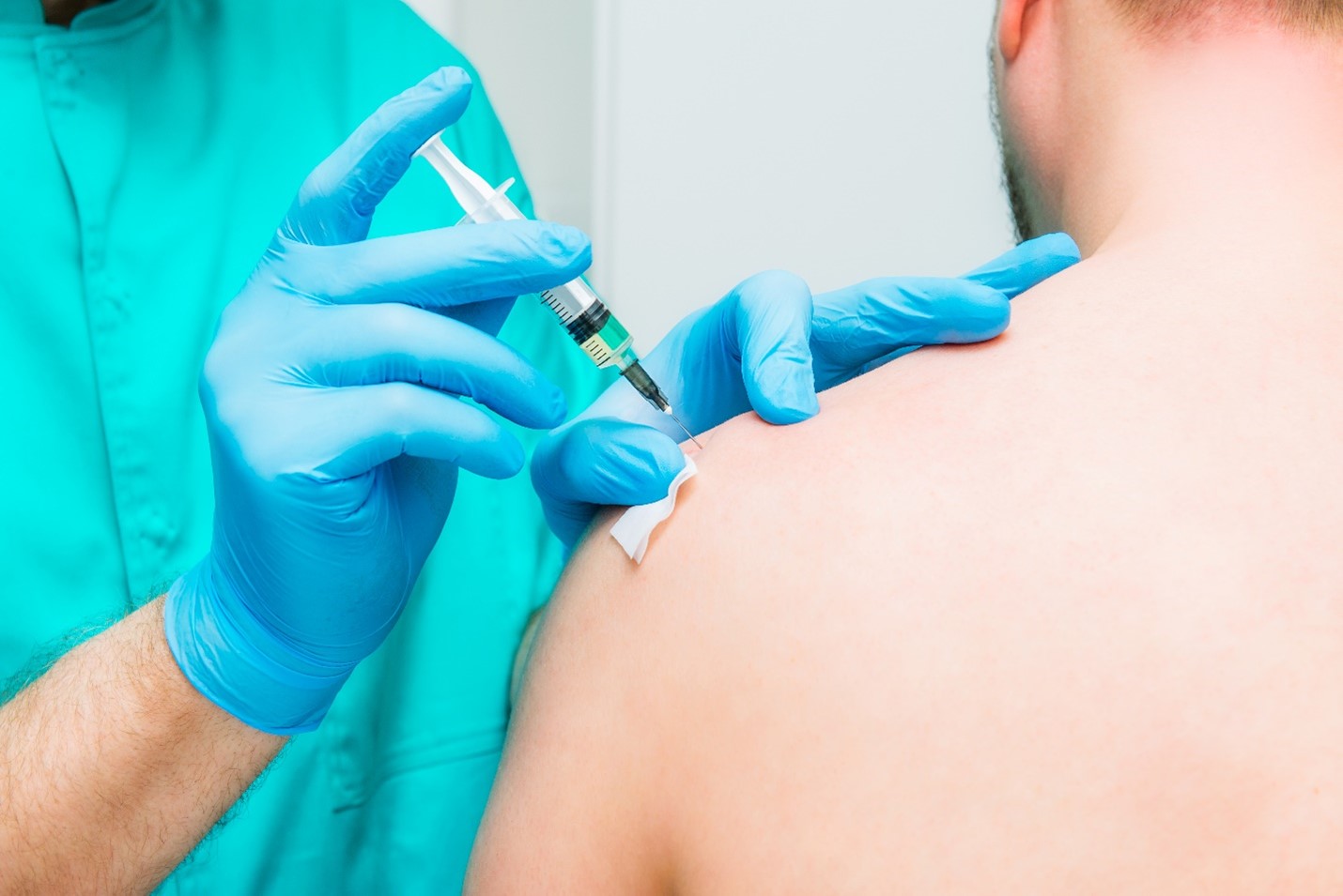 person receiving a vaccine injection
