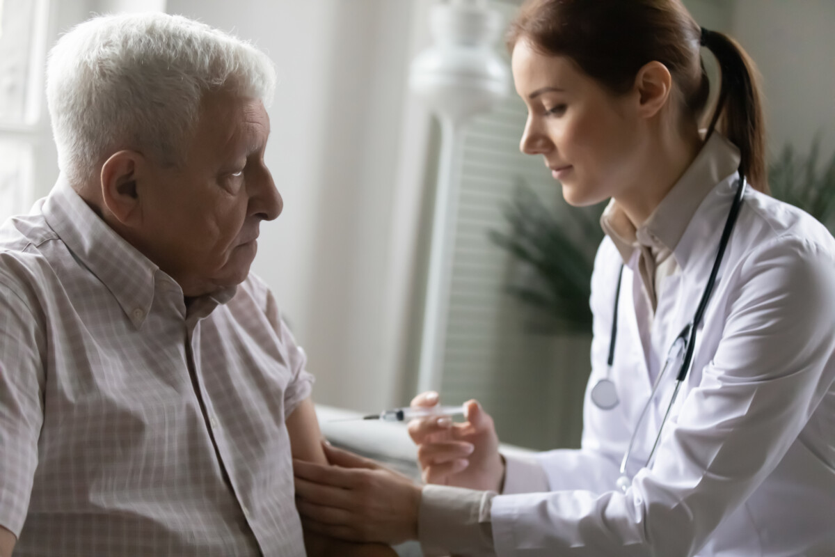 Older man with nurse or doctor