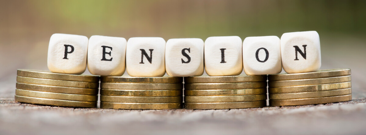 The letters PENSION on top of small stacks of coins