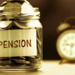 Jar labeled "pension" full of coins with an alarm clock in the background