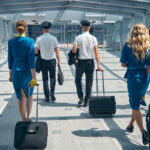 Pilots and stewardesses walking in airport