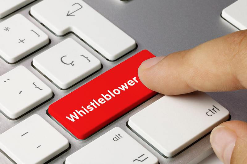 image of a red whistleblower key on keyboard about to be pressed to get employment law help