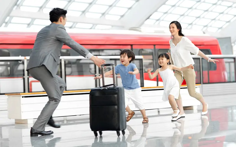 image of an asian family reuniting at an airport