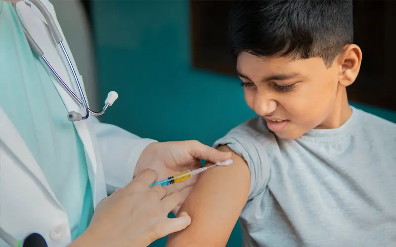 image of a young boy getting a vaccine