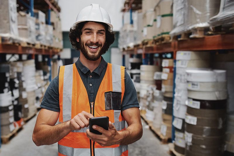 image of a warehouse worker in orange vest