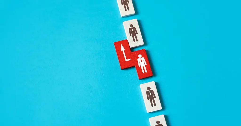 image of people on tiles in a line with one tile being moved forward, representing expedite your USCIS request