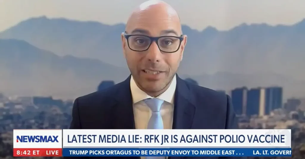 video overlay image of aaron siri on newsmax with rob finnerty discussing new york times lies about vaccines