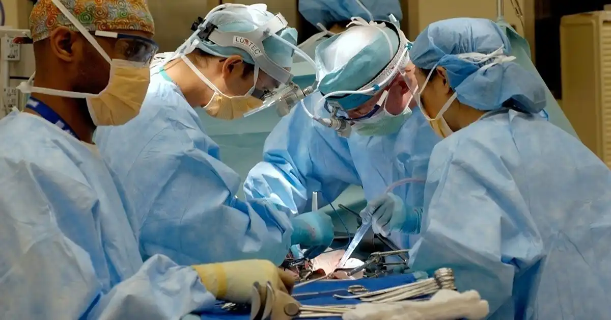 surgeons in scrubs performing surgery