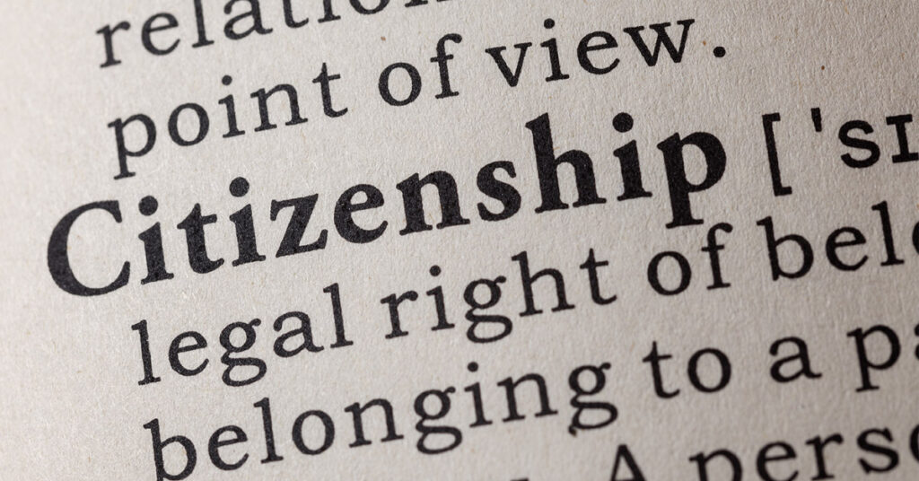 Close-up of the word “citizenship” in a dictionary, reflecting legal concepts immigration attorneys help clients understand.