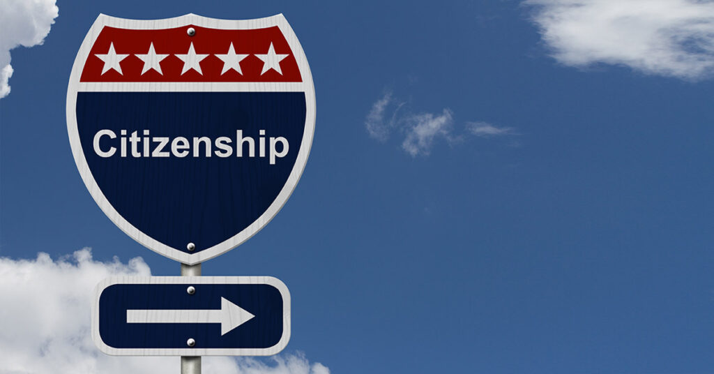 Road sign pointing toward citizenship, symbolizing the legal pathways immigration attorneys guide clients through.