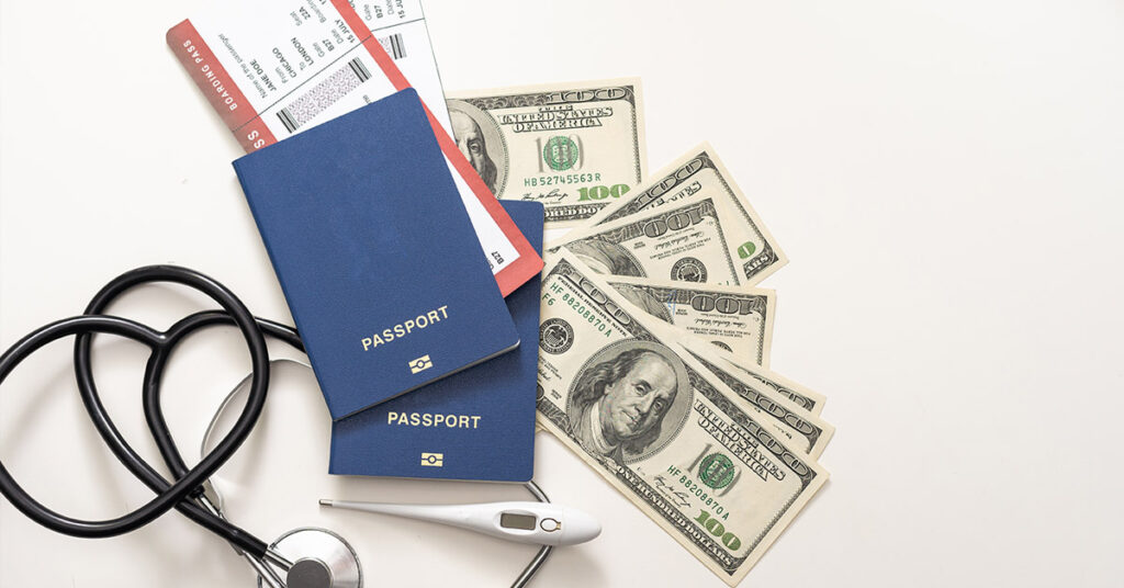 Passports, travel documents, cash, and a stethoscope, representing immigration and health-related issues handled by immigration attorneys.