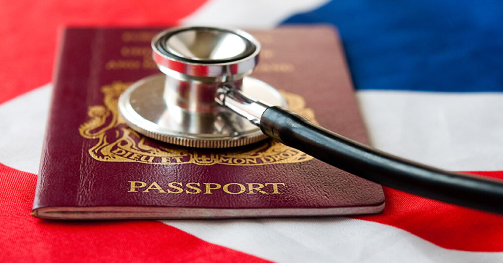 U.S. passport and stethoscope on an American flag, illustrating medical and documentation matters addressed by immigration attorneys.