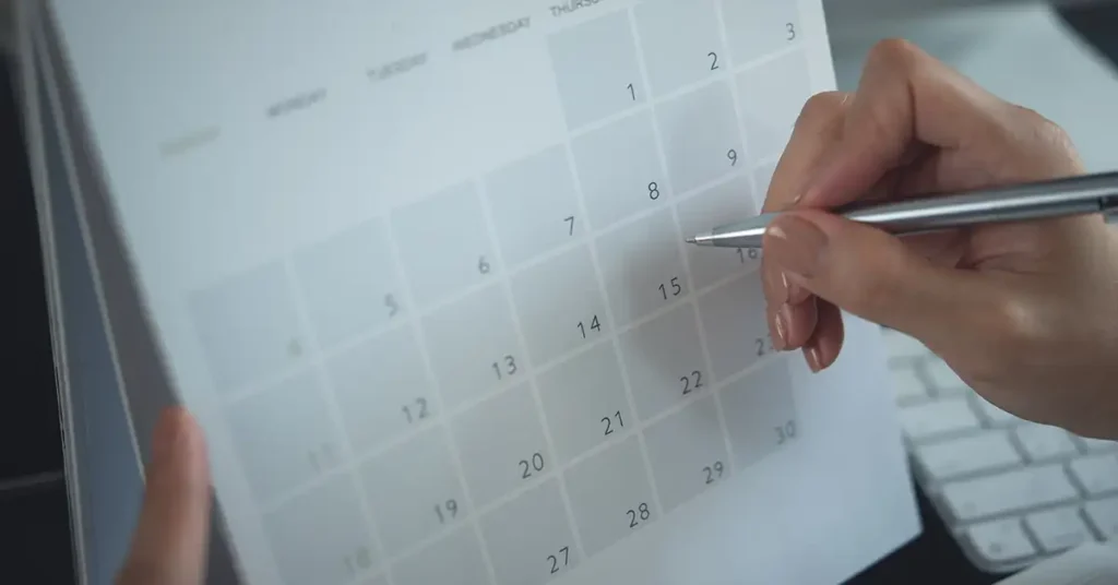 Close-up of a calendar being marked, reflecting important deadlines and timelines in the vaccine injury claims process