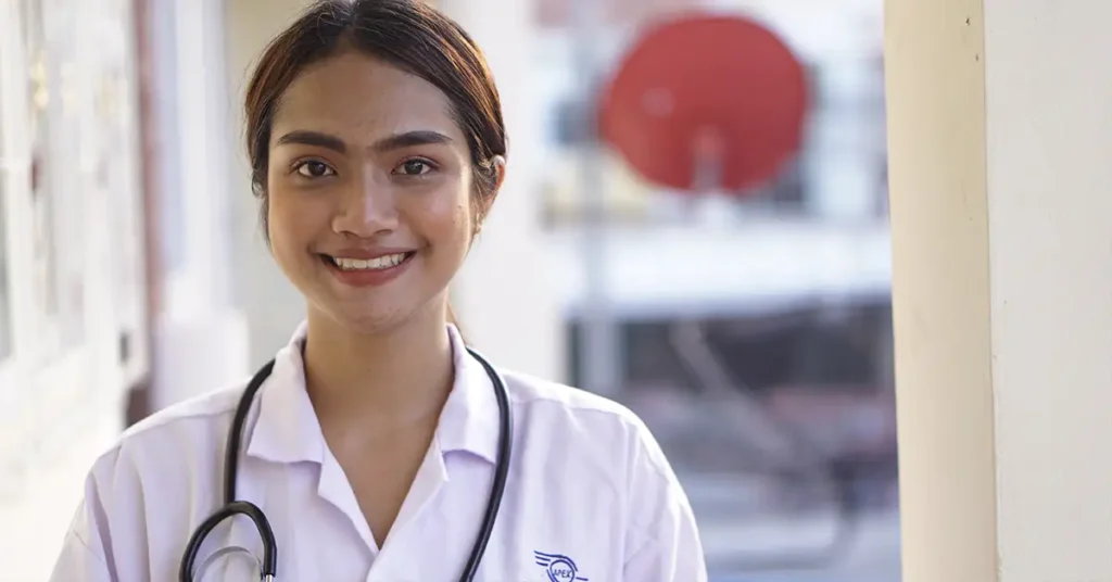 A medical professional standing in a clinical setting, representing healthcare and work authorization issues addressed by immigration attorneys.