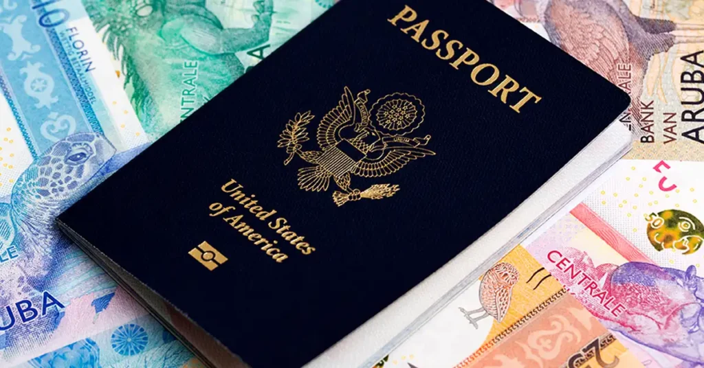 U.S. passport resting on international currency, representing cross-border travel and documentation matters handled by immigration attorneys.