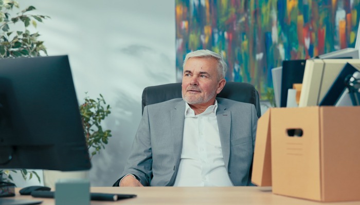 Two professionals reviewing paperwork in a modern office, representing consumer protection claims involving misleading emails and deceptive advertising.