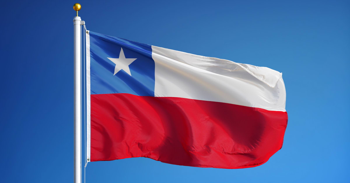 Chilean flag waving against a blue sky, representing country-specific immigration and visa matters handled by immigration attorneys.