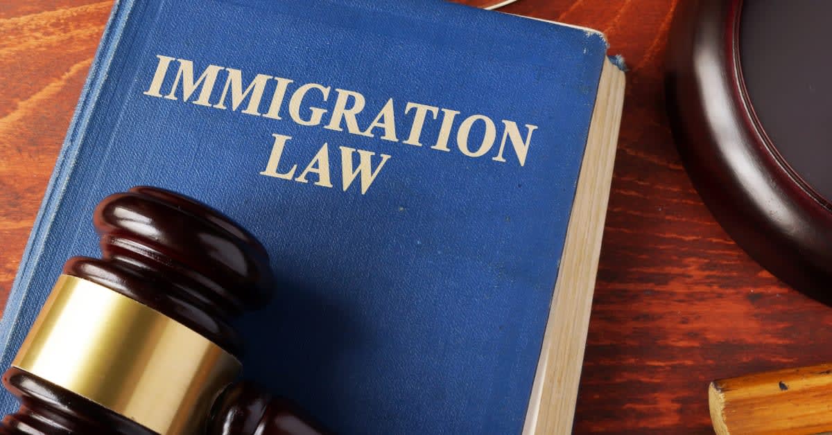 Immigration law book with a judge’s gavel, representing legal issues handled by immigration attorneys.