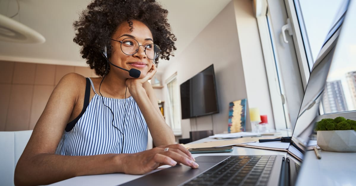 Remote worker using laptop and headset, employee vaccine exemption legal support