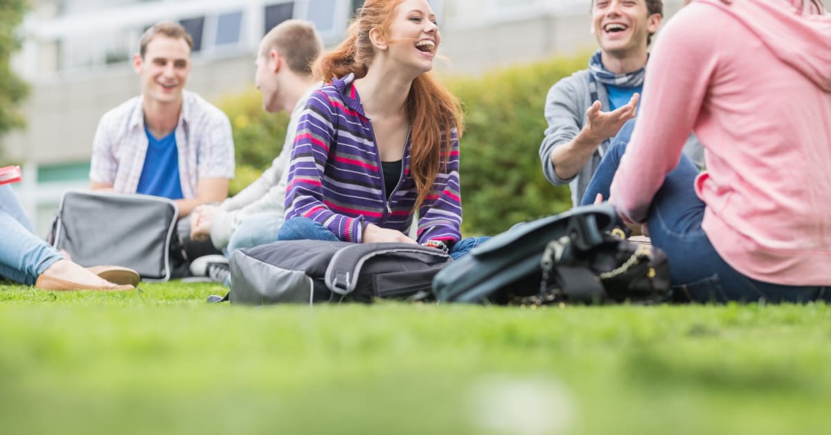 College students gathered on campus lawn, student vaccine exemption assistance for school requirements