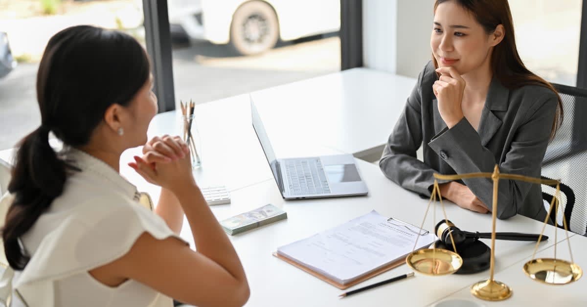 College student meeting with vaccine exemption attorney to discuss school vaccination requirements