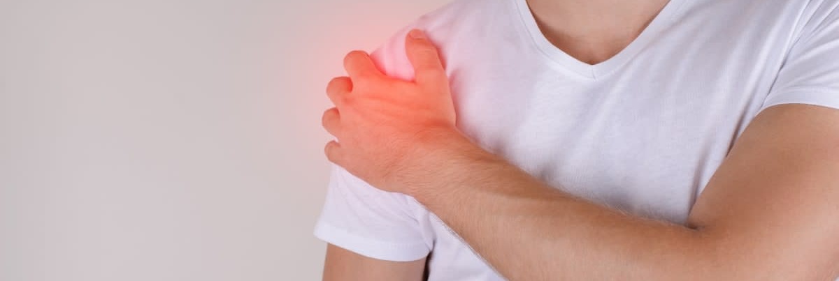 Man experiencing shoulder pain, illustrating a potential shoulder injury following a flu shot