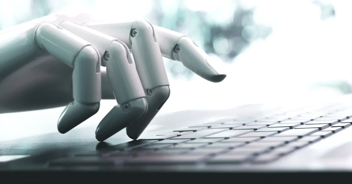 Artificial intelligence typing on laptop, representing AI-generated religious vaccine exemption requests