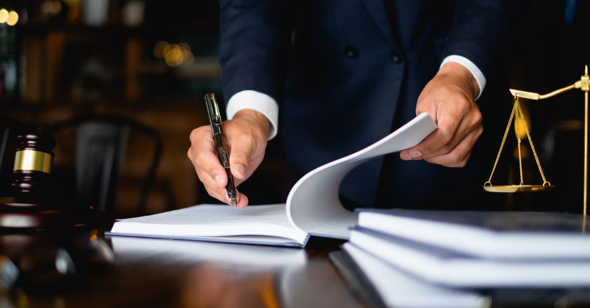 Vaccine exemption attorney reviewing legal documents and preparing an exemption case