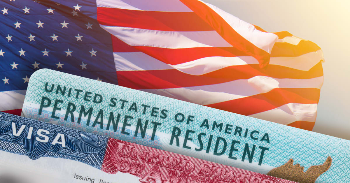 U.S. permanent resident card and visa documents against an American flag, reflecting green card and immigration matters handled by immigration attorneys.